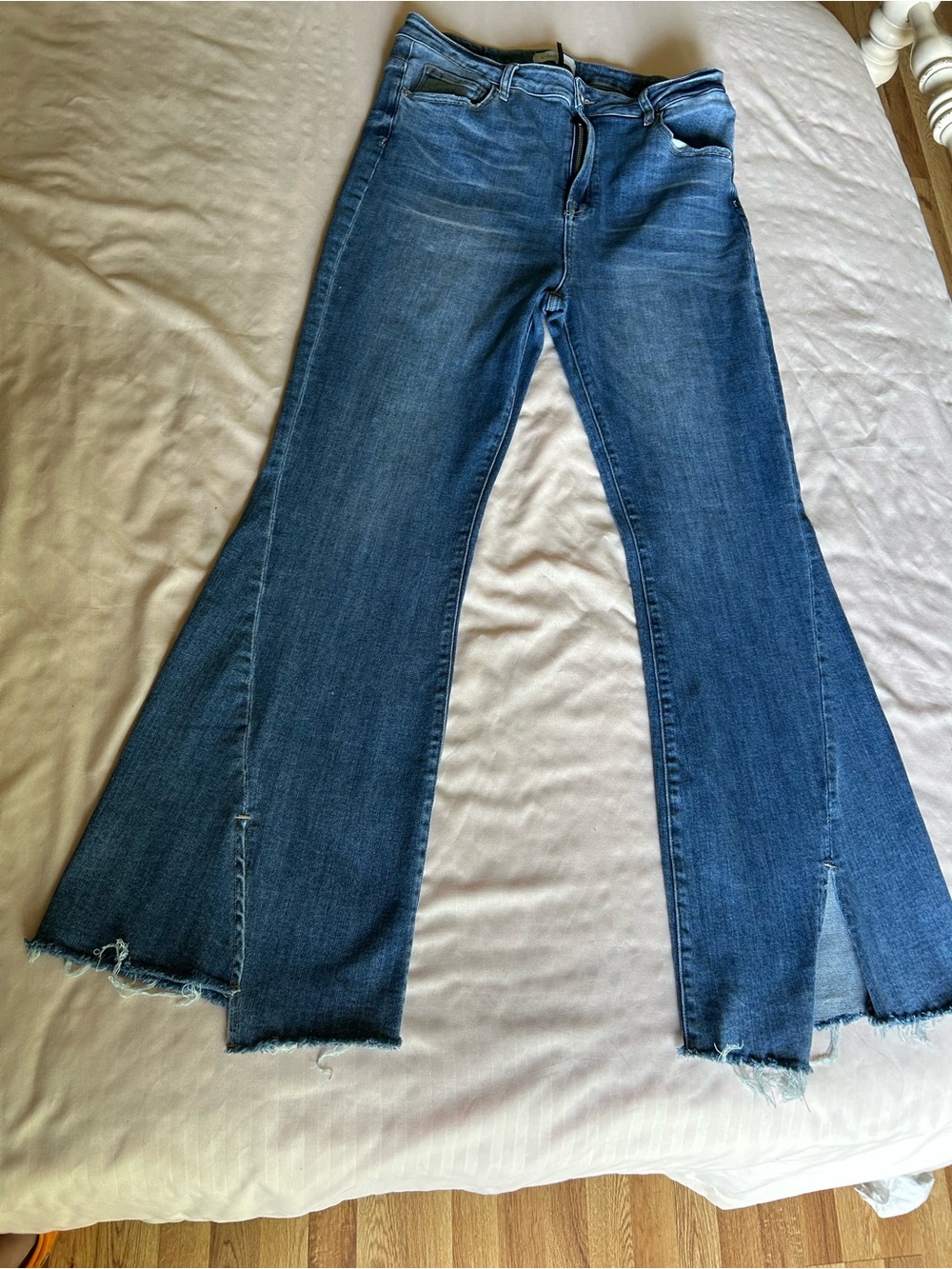 High-Rise Blue Flare Jeans with Raw Hem